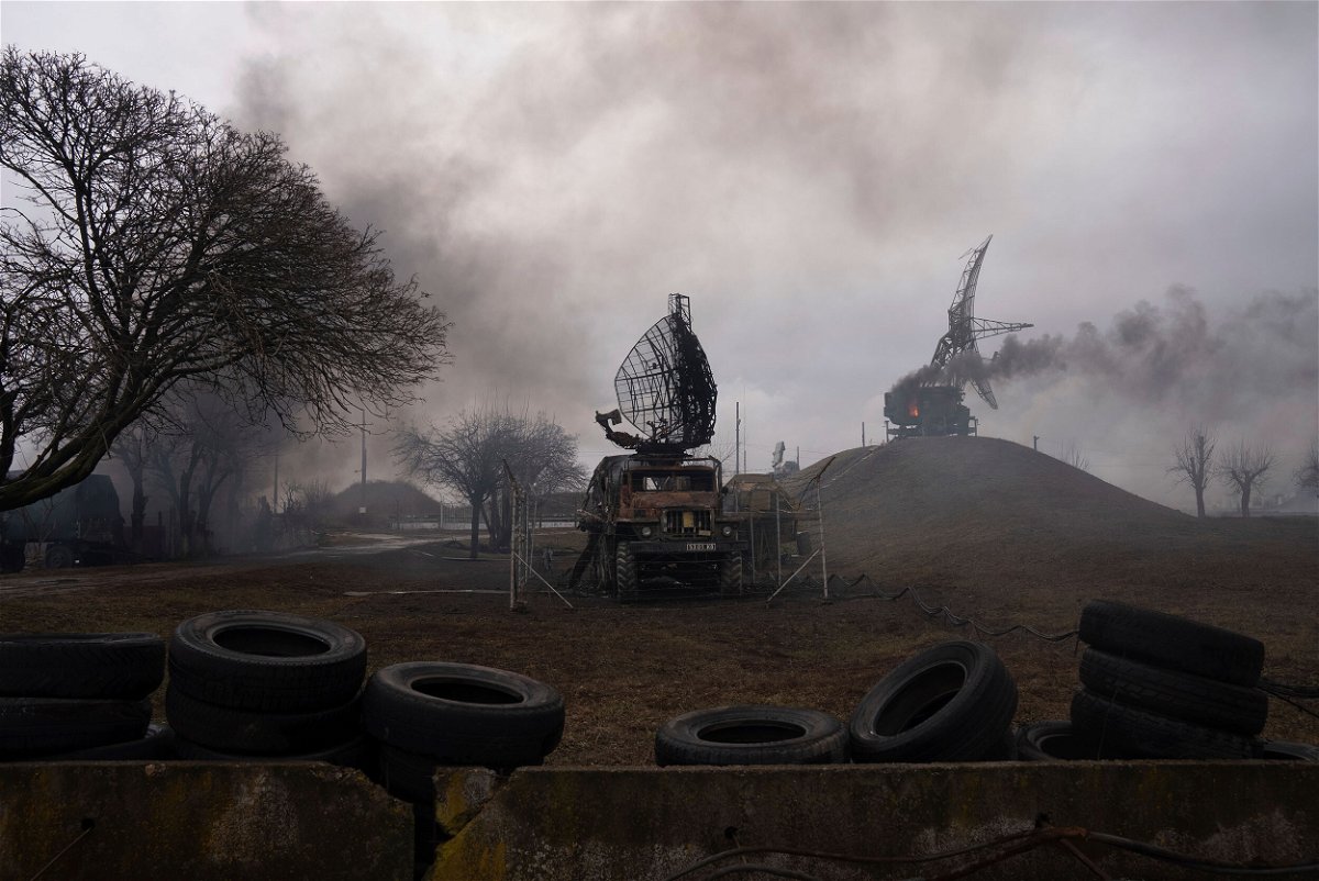 <i>Evgeniy Maloletka/AP</i><br/>Smoke rises from an air defense base in the aftermath of an apparent Russian strike in Mariupol on February 24.