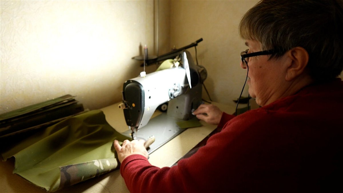 <i>CNN</i><br/>Irina Protchenko sews material for flak jackets in a corner of her living room in central Ukraine.