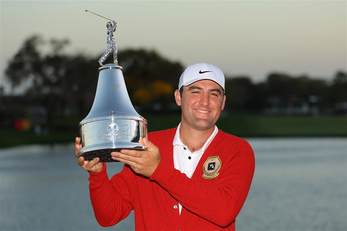 <i>Kevin C. Cox/Getty Images North America/Getty Images</i><br/>Scottie Scheffler poses with the trophy after winning the Arnold Palmer Invitational.