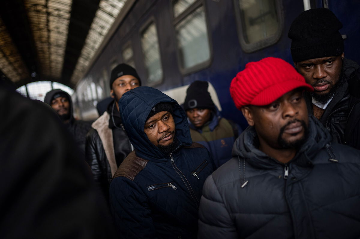 <i>Bernat Armangue/AP</i><br/>African residents in Ukraine wait at the platform inside Lviv railway station on February 27.
