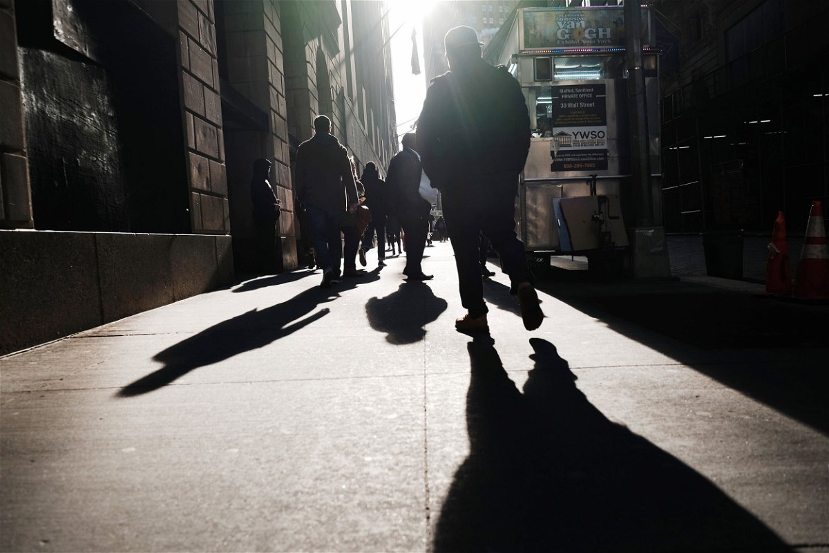 <i>Spencer Platt/Getty Images</i><br/>A Gallup survey released on March 18 reveals that 1 in 4 American workers feel their employers don't care about their well-being. Pictured are people walking along Wall Street on February 16 in New York City.