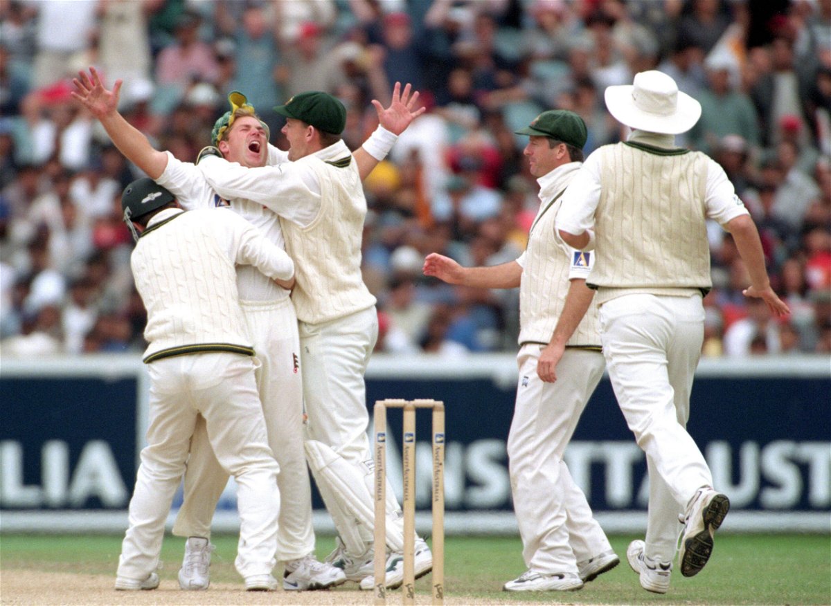 <i>Jack Atley/ALLSPORT/Getty Images</i><br/>Warne celebrates with his teammates after taking the wicket Sachin Tendulkar in 1999.