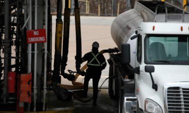 A worker refuels a gasoline tanker truck at the Valero Energy Corp. oil refinery terminal in Memphis