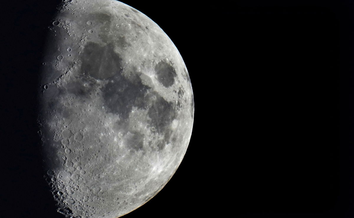 <i>Michael Sohn/AP</i><br/>Space junk is set to collide with the moon on Friday. Impact craters cover the surface of the moon as it's seen over Berlin