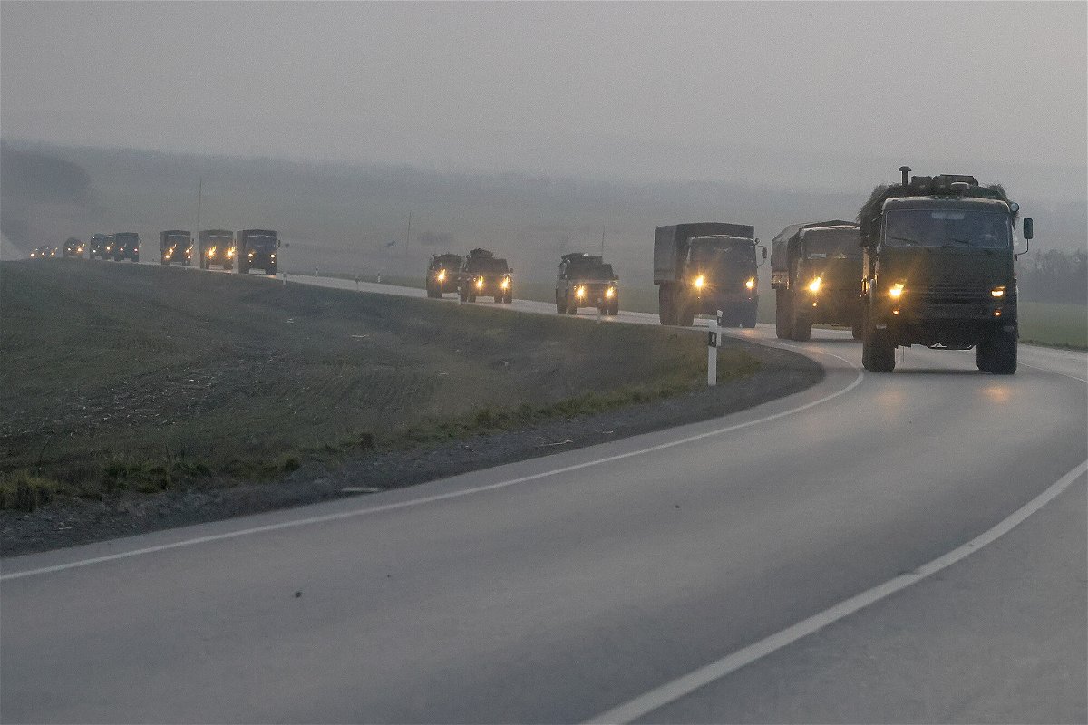 <i>Anadolu Agency/Getty Images</i><br/>A convoy of Russian military vehicles is seen moving towards the border in the Donbas region of eastern Ukraine on February 23