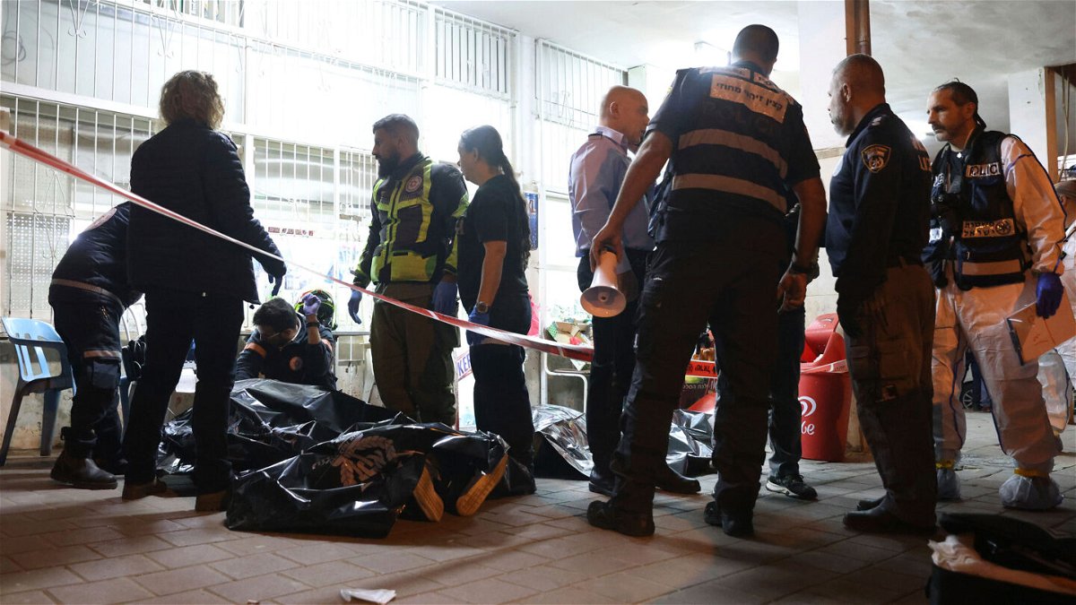 <i>Ofer Vaknin/AP</i><br/>Israeli police and paramedics gather near bodies of people killed by a gunman in Bnei Brak