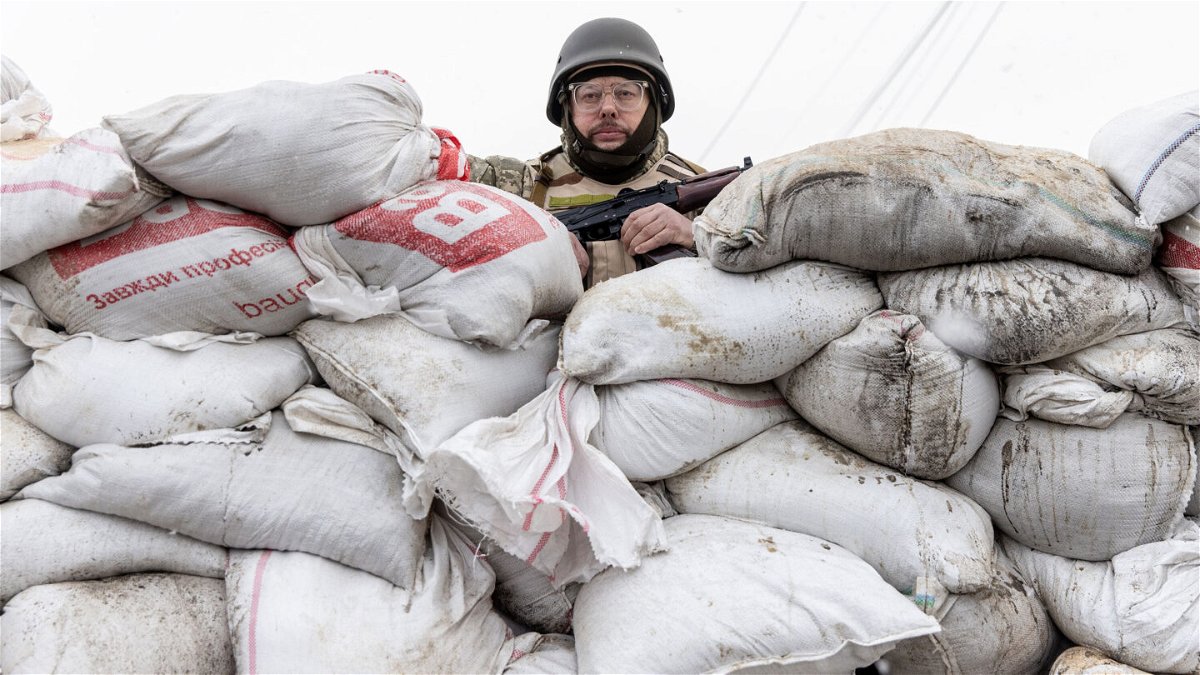 <i>Chris McGrath/Getty Images</i><br/>A member of Ukraine's Territorial Defense unit guards a barricade on the outskirts of eastern Kyiv on March 06