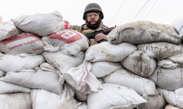 A member of Ukraine's Territorial Defense unit guards a barricade on the outskirts of eastern Kyiv on March 06