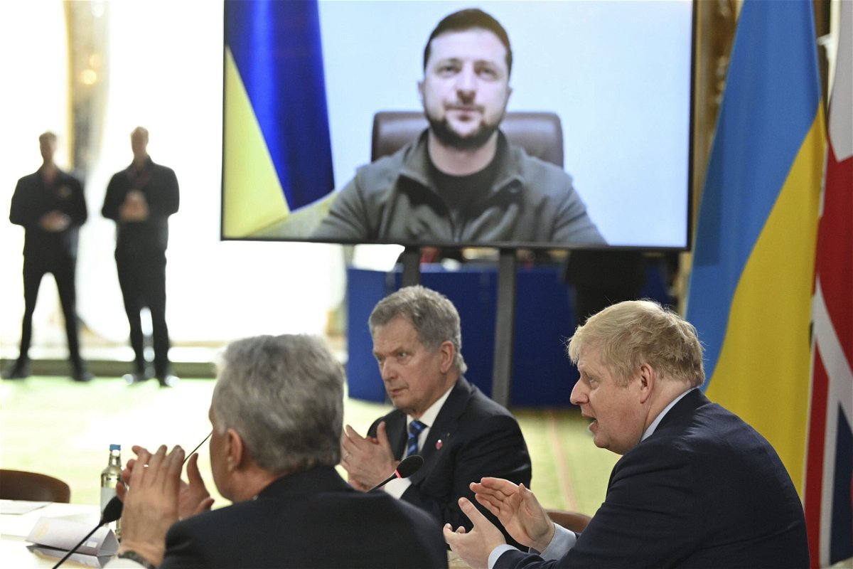 <i>Justin Tallis/AP</i><br/>British Prime Minister Boris Johnson and attendees applaud after Ukraine's President Volodymyr Zelensky addressed a meeting of the Joint Expeditionary Force in London on March 15. Zelensky signals he doesn't expect Ukraine to join NATO anytime soon.