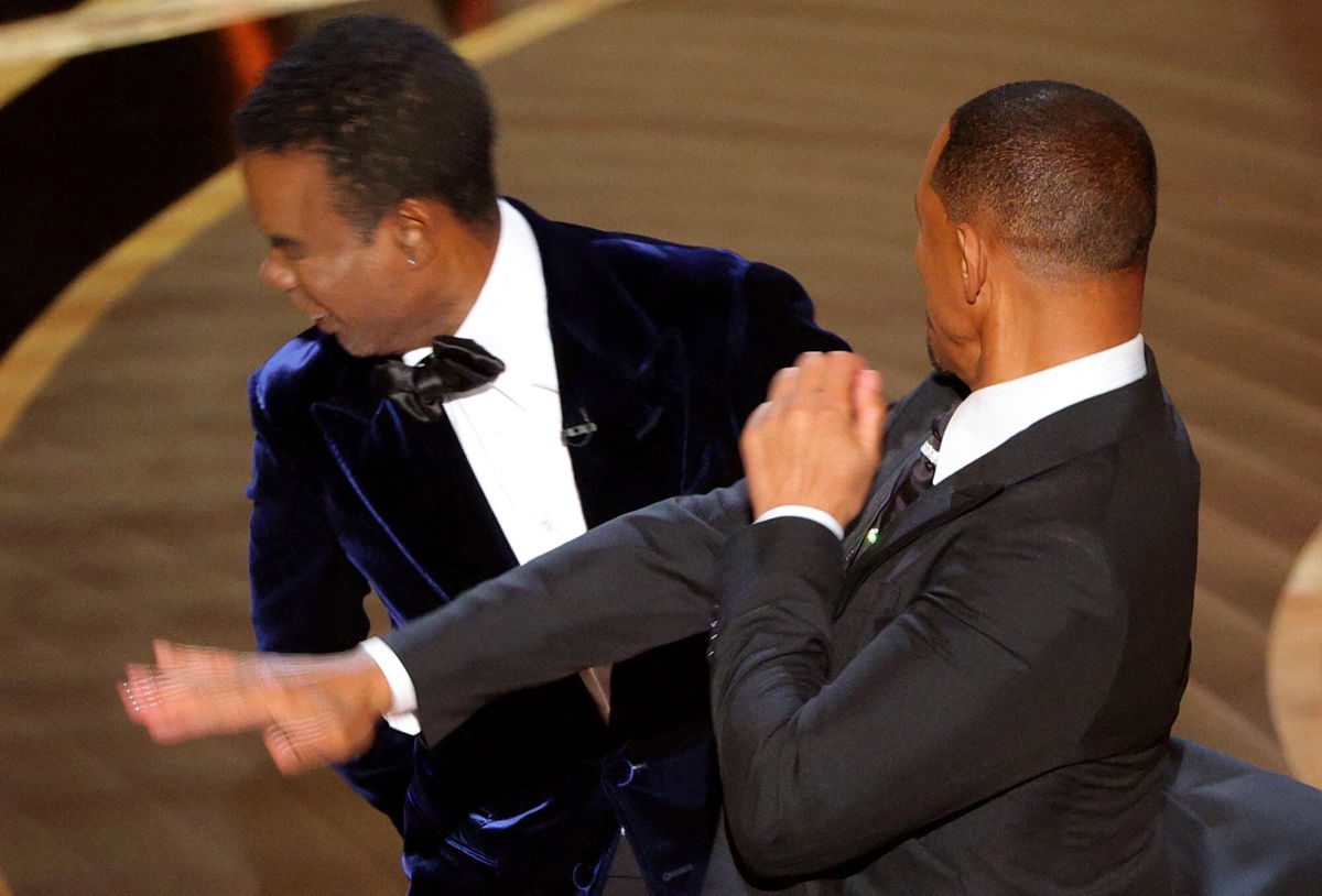 <i>Brian Snyder/Reuters</i><br/>Will Smith (R) hits Chris Rock on stage during the 94th Academy Awards in Los Angeles on March 27. The Academy of Motion Pictures Arts and Sciences told members its leaders are 