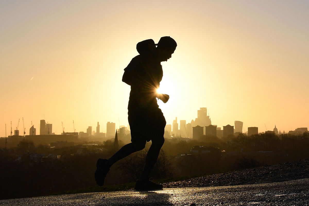 <i>Justin Tallis/AFP/Getty Images</i><br/>A jogger runs up Primrose Hill in London on February 17. A full-body workout like running or swimming burns the most calories.