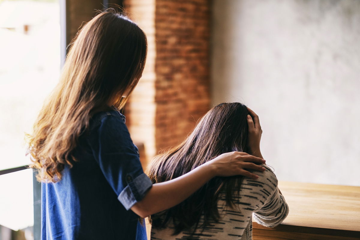 <i>Farknot Architect/Adobe Stock</i><br/>A woman comforts and supports her friend. Help from educated loved ones can make a world of difference for people with eating disorders.