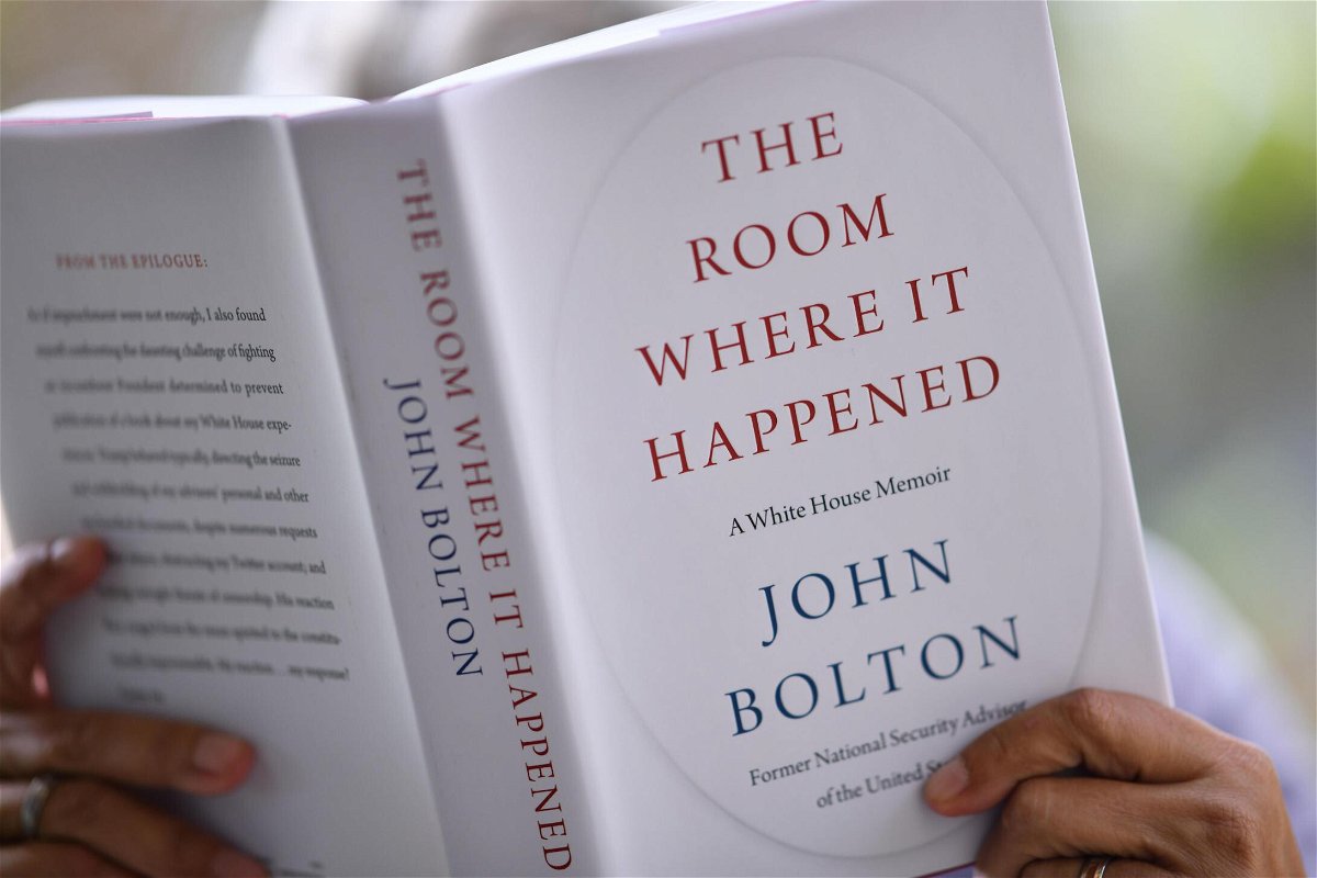 <i>CHRIS DELMAS/AFP/Getty Images</i><br/>A person is shown reading John Bolton's book 