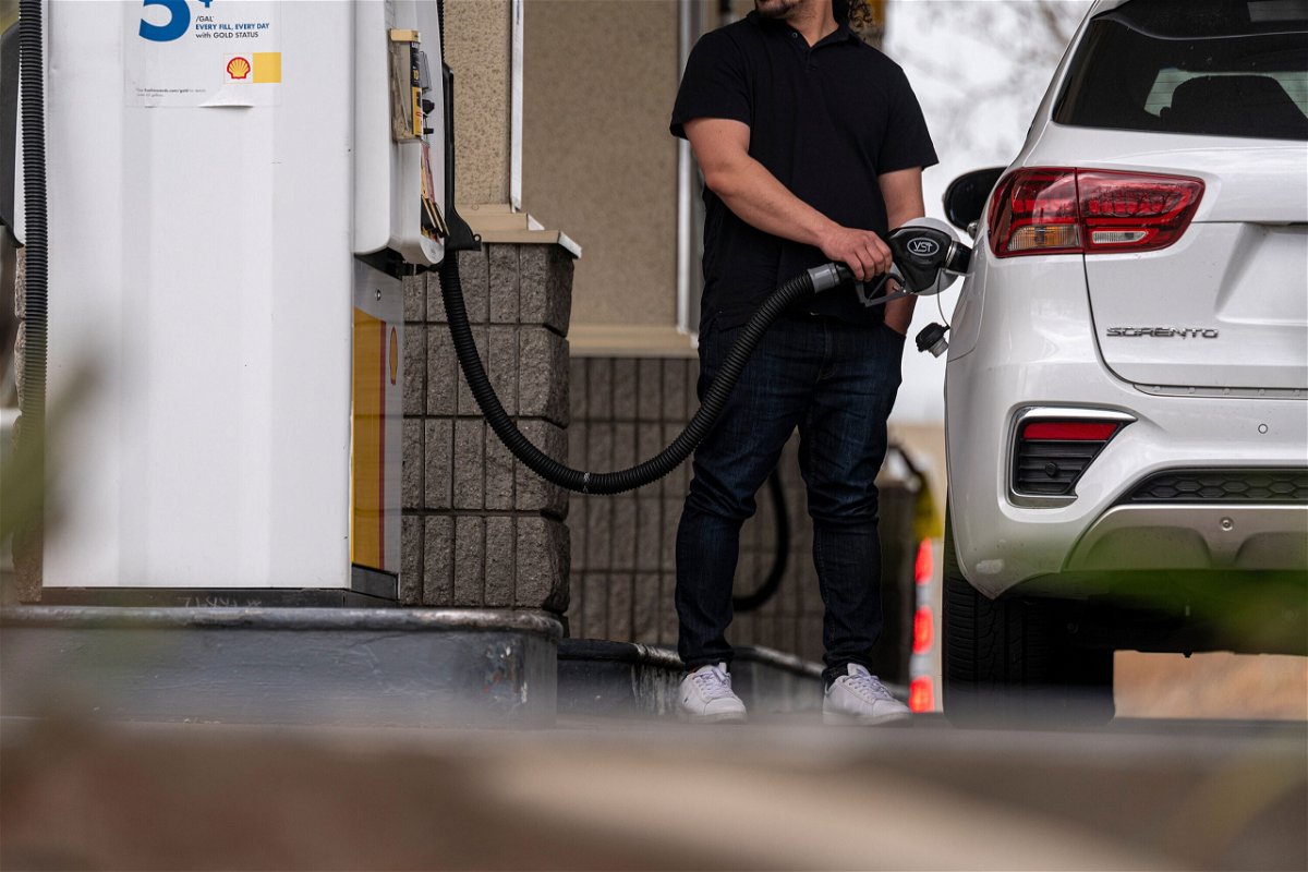 <i>David Paul Morris/Bloomberg via Getty Images</i><br/>A driver holds a fuel nozzle at a Shell gas station in Hercules
