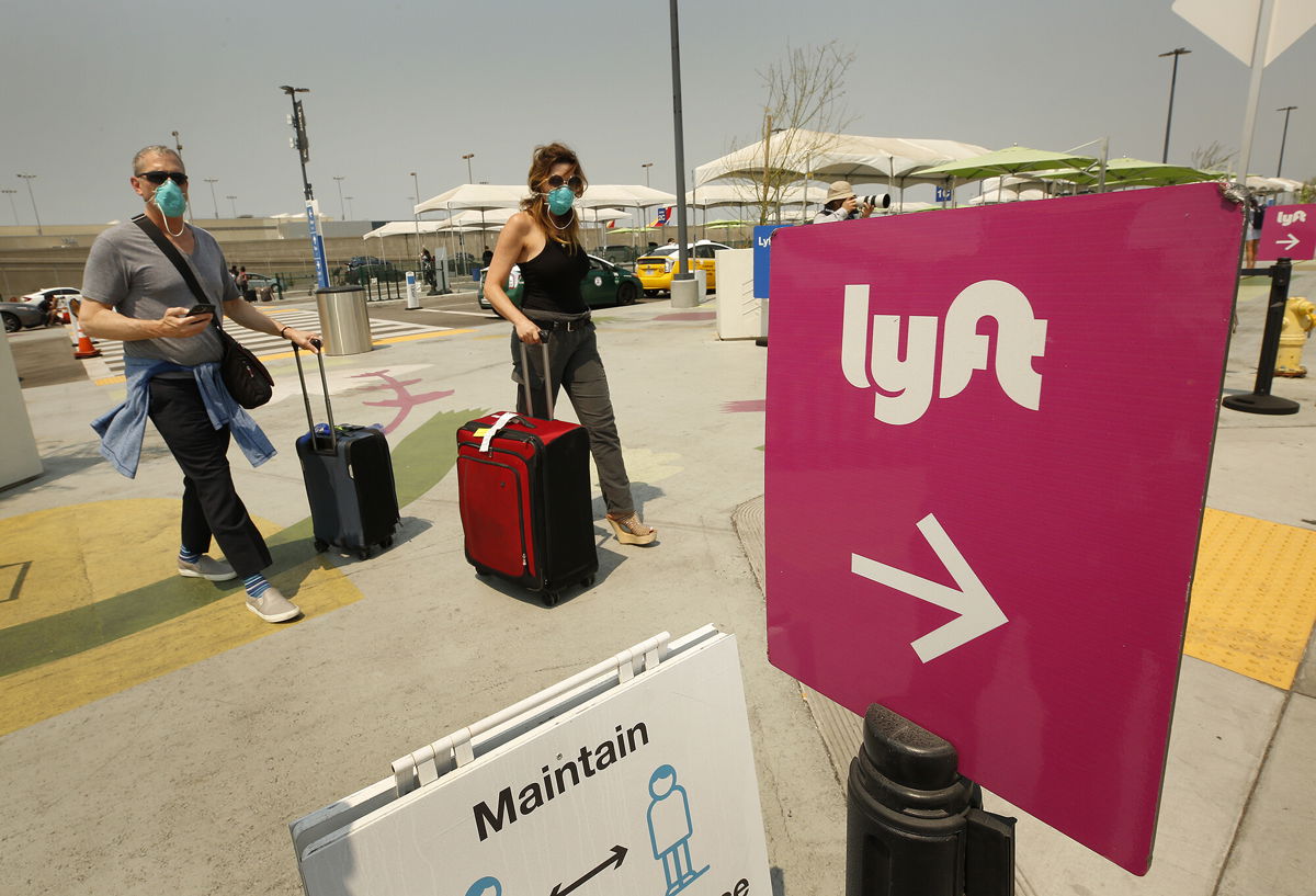 <i>Al Seib/Los Angeles Times/Shutterstock</i><br/>Lyft on Monday said it plans to add a small fee on rides to help drivers deal with rising gas prices across the country