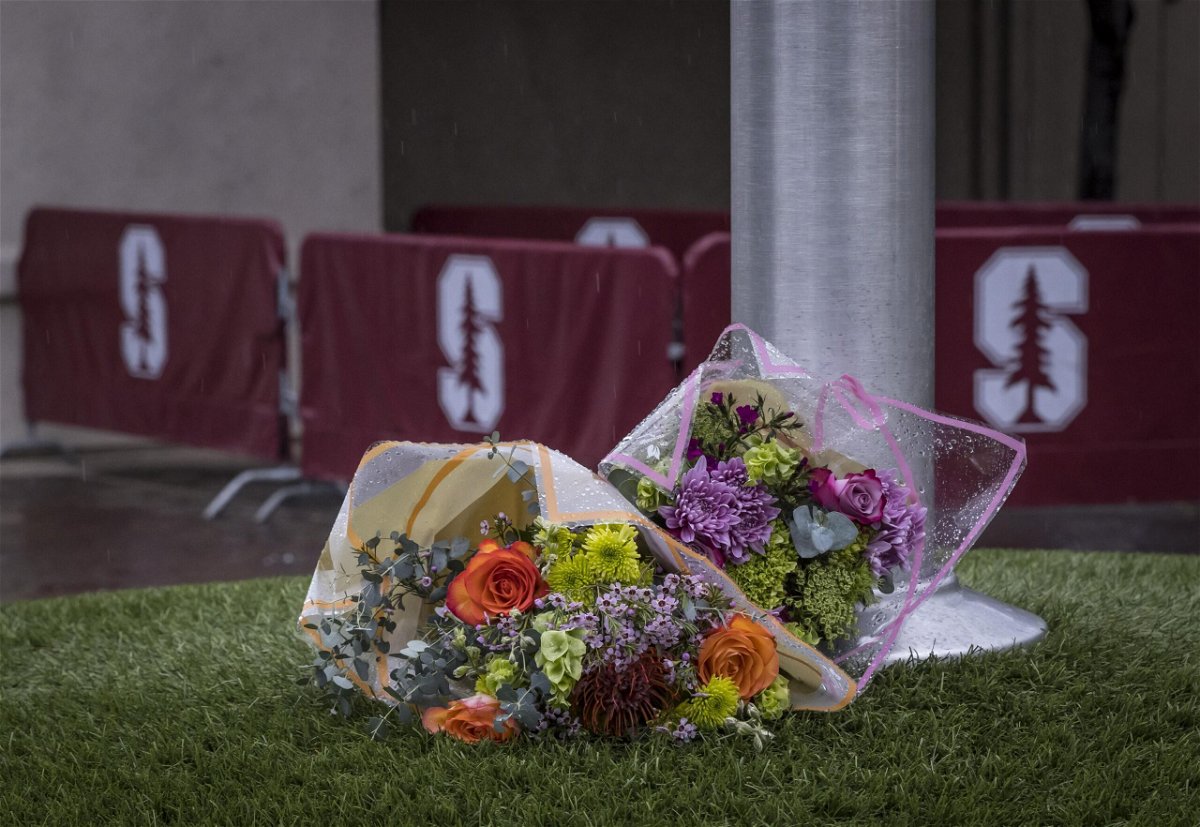 <i>Carlos Avila Gonzalez/San Francisco Chronicle/Getty Images</i><br/>A bouquet of flowers lies at the base of a flagpole outside Maloney Field at Laird Q. Cagan Stadium where at Stanford University soccer players practiced in Stanford