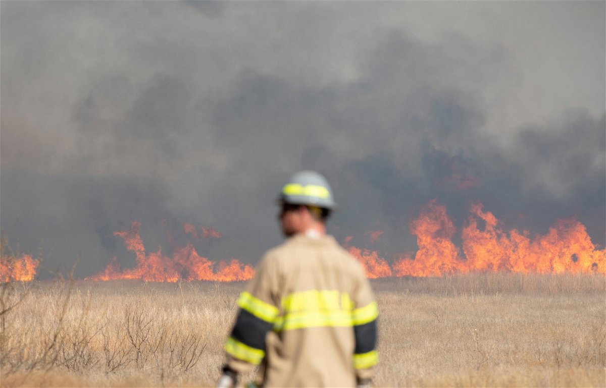 <i>Christopher Walker/Times Record News/USA Today Network</i><br/>The Wichita County Sheriff's Office respond to a large wildfire in Texas on March 20.