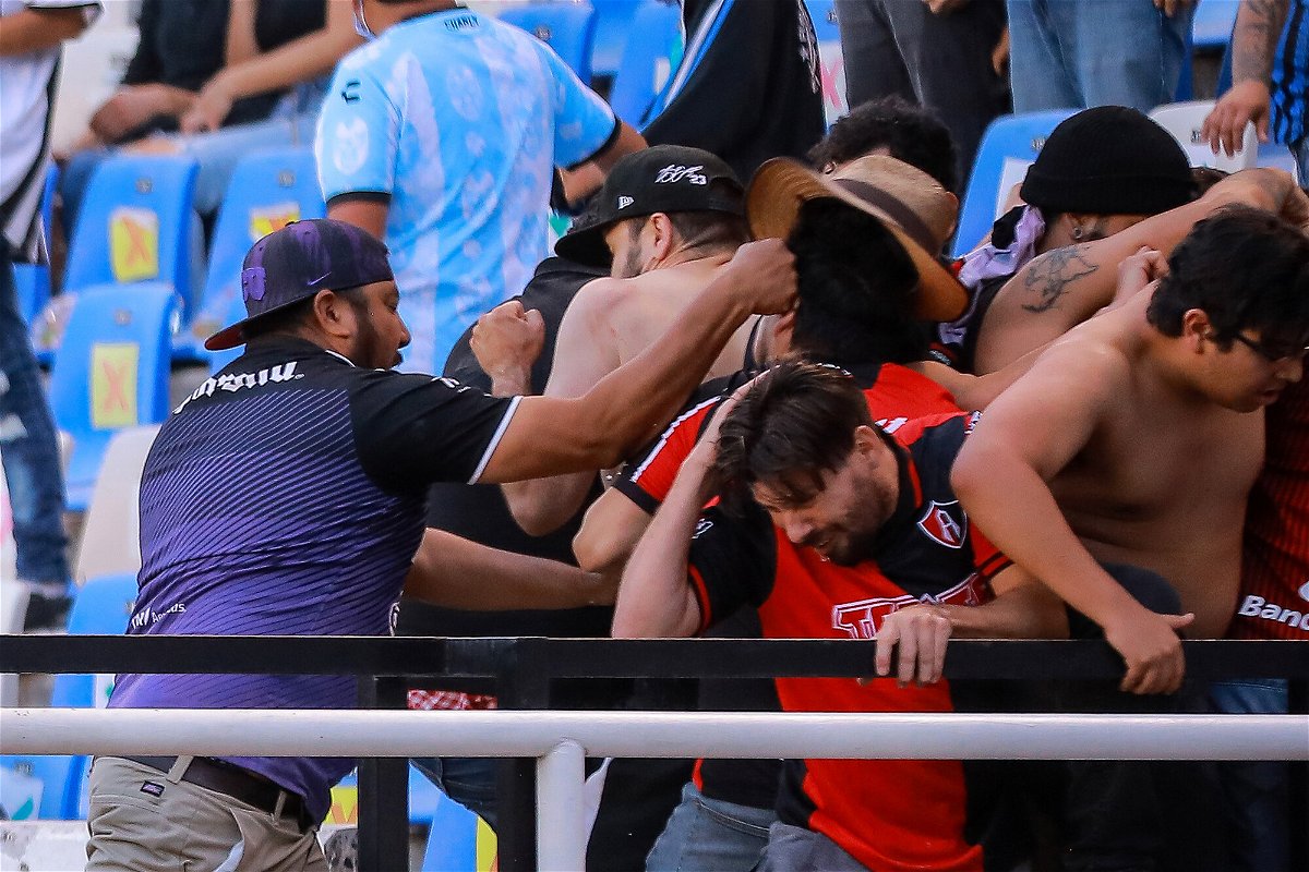 <i>Manuel Velasquez/Getty Images</i><br/>Fans clash in the stands during the match between Querétaro and Atlas.