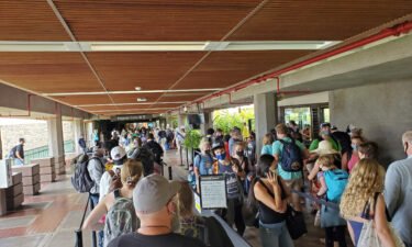 Long security lines are visible at Kahului Airport as passengers wait for departing flights from the island of Maui on August 5.