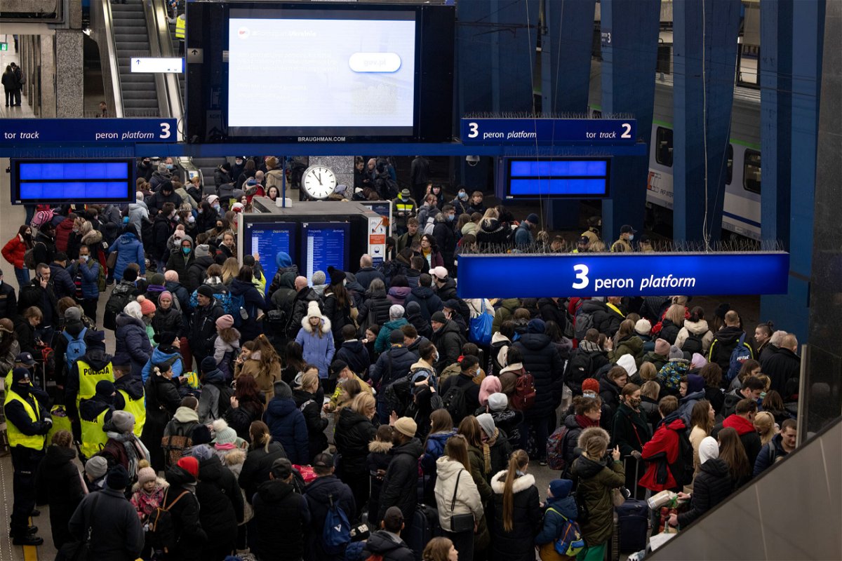 <i>Hesther Ng/SOPA Images/LightRocket/Getty Images</i><br/>Crowds wait for a train to Berlin at Warsaw's central train station.