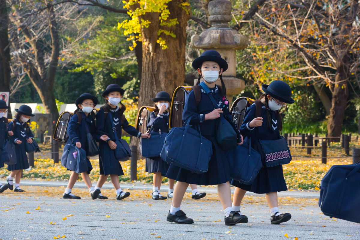 <i>Stanislav Kogiku/SOPA Images/LightRocket/Getty Images</i><br/>Elementary school students walk home after their lessons in Tokyo