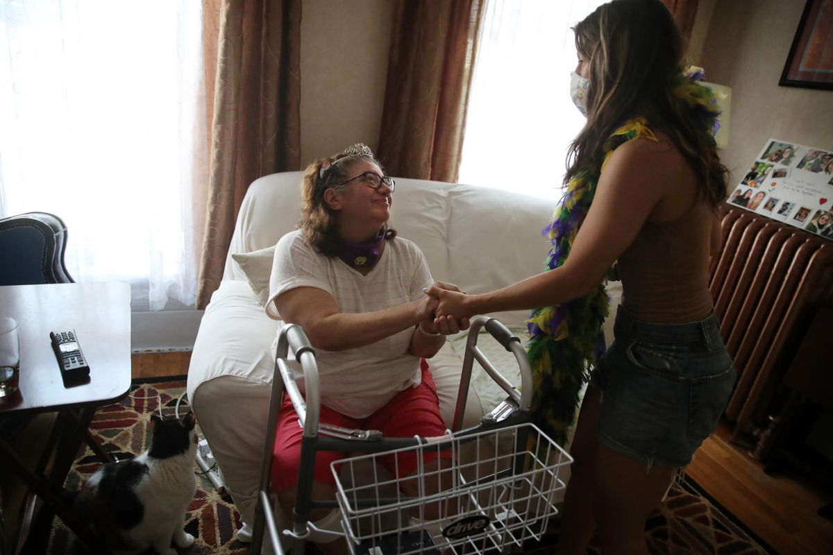 <i>Craig F. Walker/The Boston Globe/Getty</i><br/>Nina Coletta (L) returned to her home in Boston