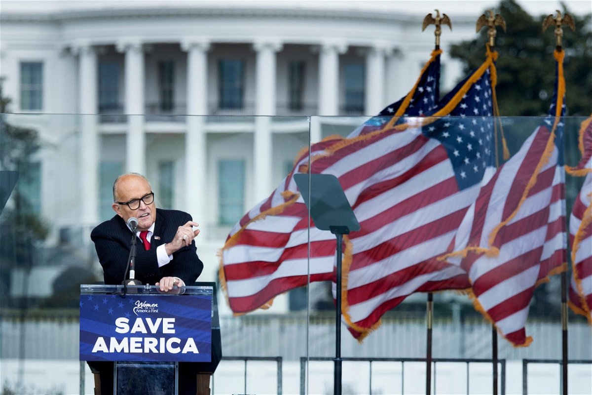 <i>Brendan Smialowski/AFP/Getty Images</i><br/>Rudy Giuliani speaks to supporters from The Ellipse near the White House on January 6