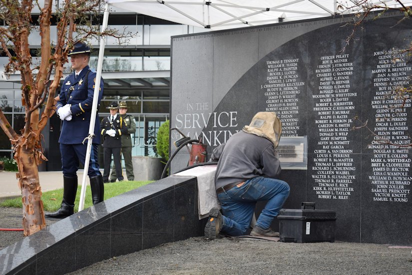 Engraver adds three names to the Oregon Fallen Law Enforcement Memorial Wall
