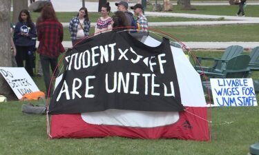 Dozens of University of Vermont students are spending the night on the Davis Center Green to stand in solidarity with university staff.