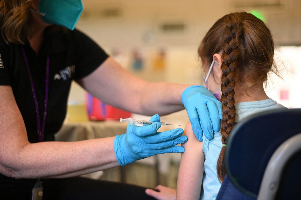 <i>Robyn Beck/AFP/Getty Images</i><br/>A nurse administers a pediatric dose of the Covid-19 vaccine to a girl in Los Angeles on January 19. Covid-19 vaccines could be authorized for the United States' youngest children as early as June.
