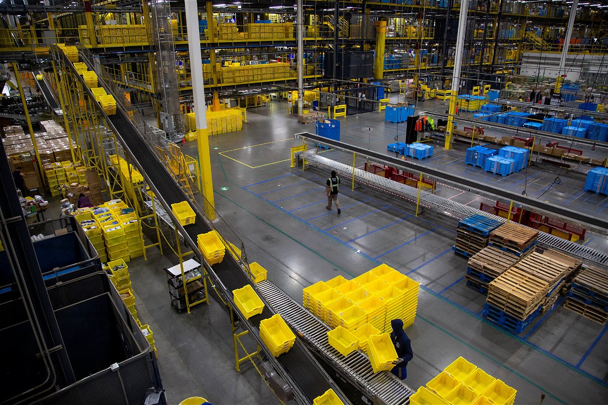 <i>Michael Nagle/Bloomberg/Getty Images</i><br/>Bins move along a conveyor at an Amazon fulfillment center on Cyber Monday in Robbinsville