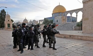 Israeli police and Palestinian demonstrators (not pictured) clash at Jerusalem's Al-Aqsa mosque compound after the morning prayer in east Jerusalem on April 22