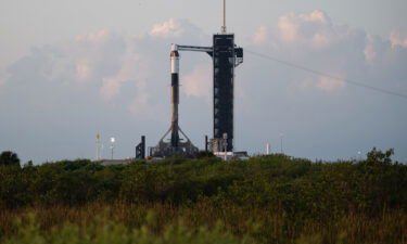 A SpaceX Falcon 9 rocket with the company's Crew Dragon spacecraft is seen at sunrise on the launch pad at Launch Complex 39A as preparations continue for Axiom Mission 1
