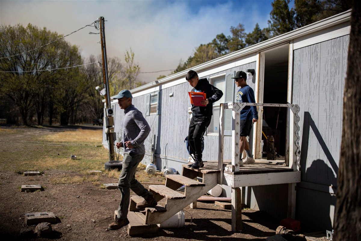 <i>Ivan Pierre Aguirre/USA Today Network/Sipa</i><br/>A family evacuated as the McBride Fire got closer to their property in Ruidoso