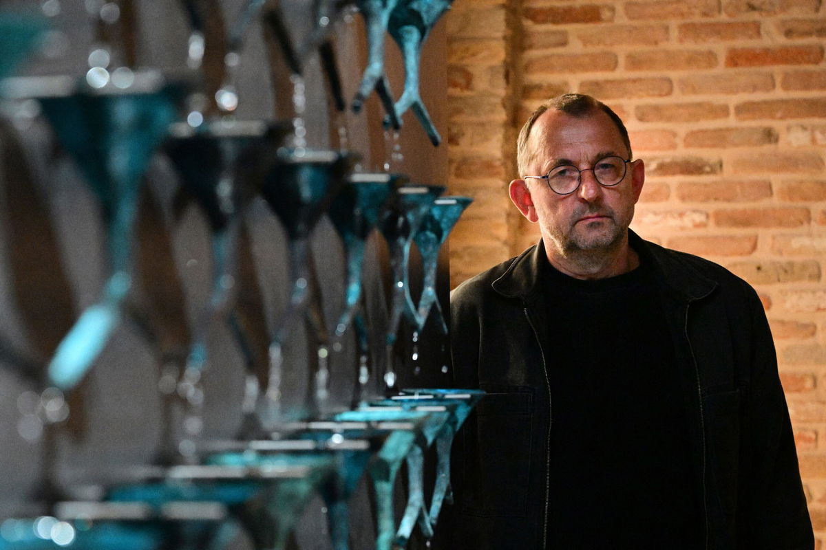 <i>VINCENZO PINTO/AFP/Getty Images</i><br/>Ukrainian artist Pavlo Makov poses by his piece 'Fountain of Exhaustion' at Ukraine's pavilion during a press day at the 59th Venice Art Biennale in Venice on April 19.