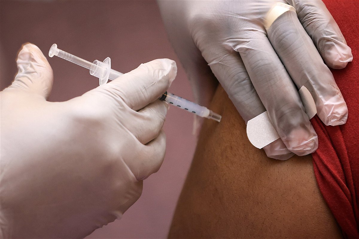 <i>Chip Somodevilla/Getty Images</i><br/>Pharmacist Fedelis Onyimba injects the Moderna COVID-19 vaccine into one of about 200 people who got their shots at First Baptist Church of Highland Park on March 18