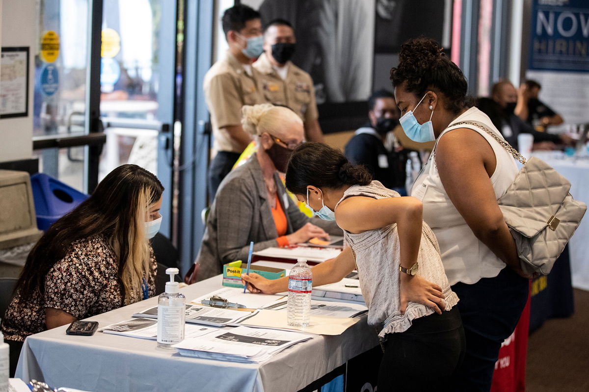 <i>Etienne Laurent/EPA-EFE/Shutterstock</i><br/>Job seekers interact with recruiters during a 'Back to Work' job fair organized by Goodwill in Los Angeles