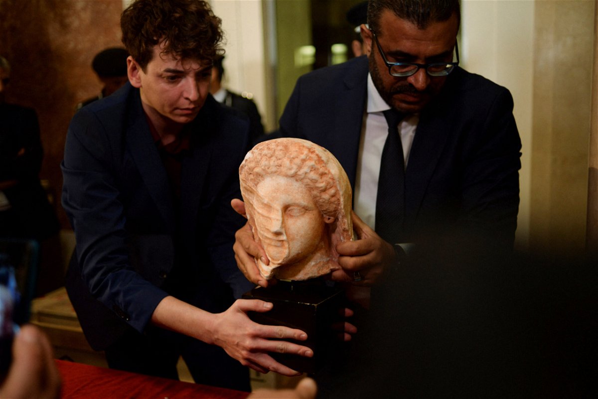 <i>NADA HARIB/REUTERS</i><br/>The Libyan Antiquities Authority holds a ceremony on March 31 for the repatriation of the artifacts returned by the US Department of Homeland Security.