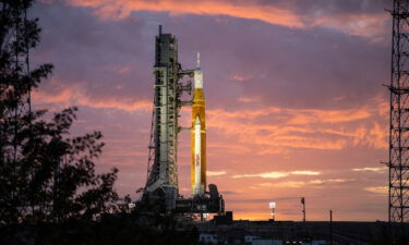The sunrise casts a golden glow on the Artemis I Space Launch System (SLS) and Orion spacecraft at Launch Pad 39B at NASA's Kennedy Space Center in Florida on March 23