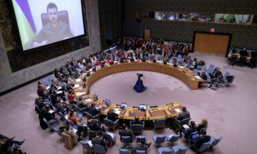 Ukrainian President Volodymyr Zelenskiy appears on a screen as he addresses the United Nations Security Council via video link during a meeting