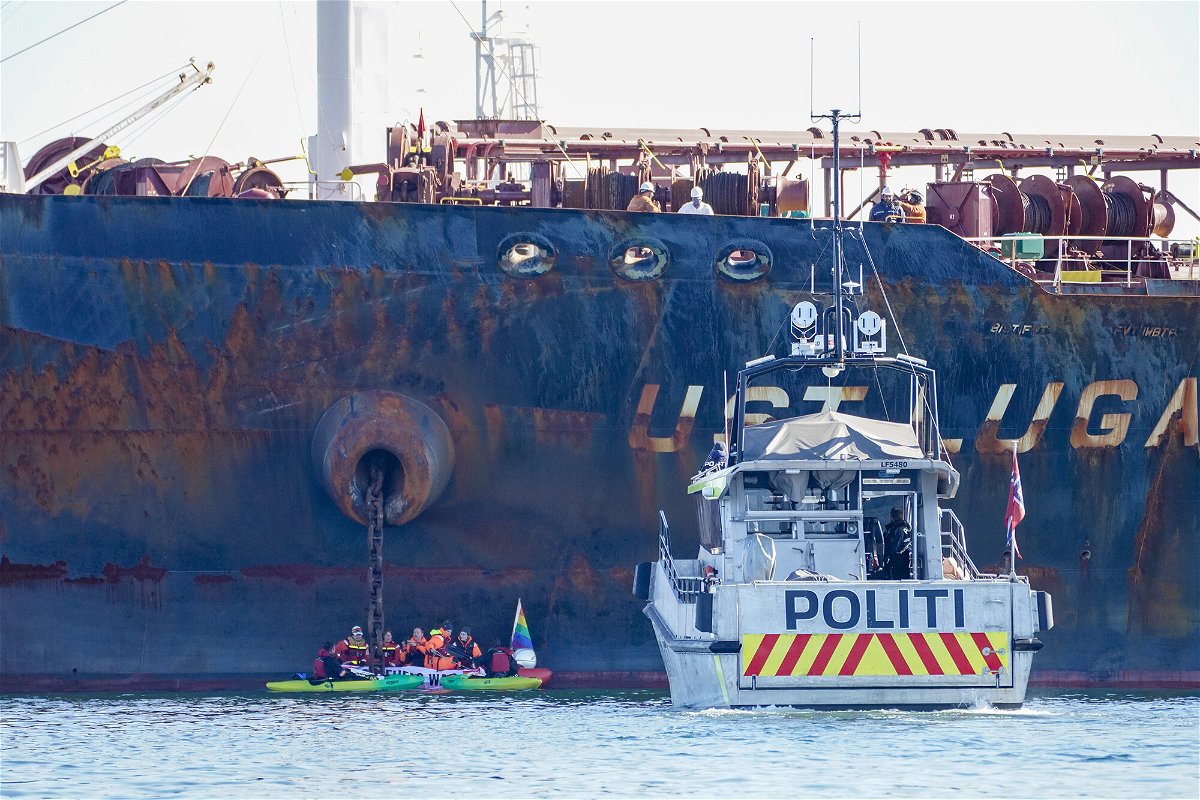 <i>Ole Berg-Rusten/AP</i><br/>A police boat is pictured at the scene as members of Greenpeace stage a protest against the Ust Luga on April 25.