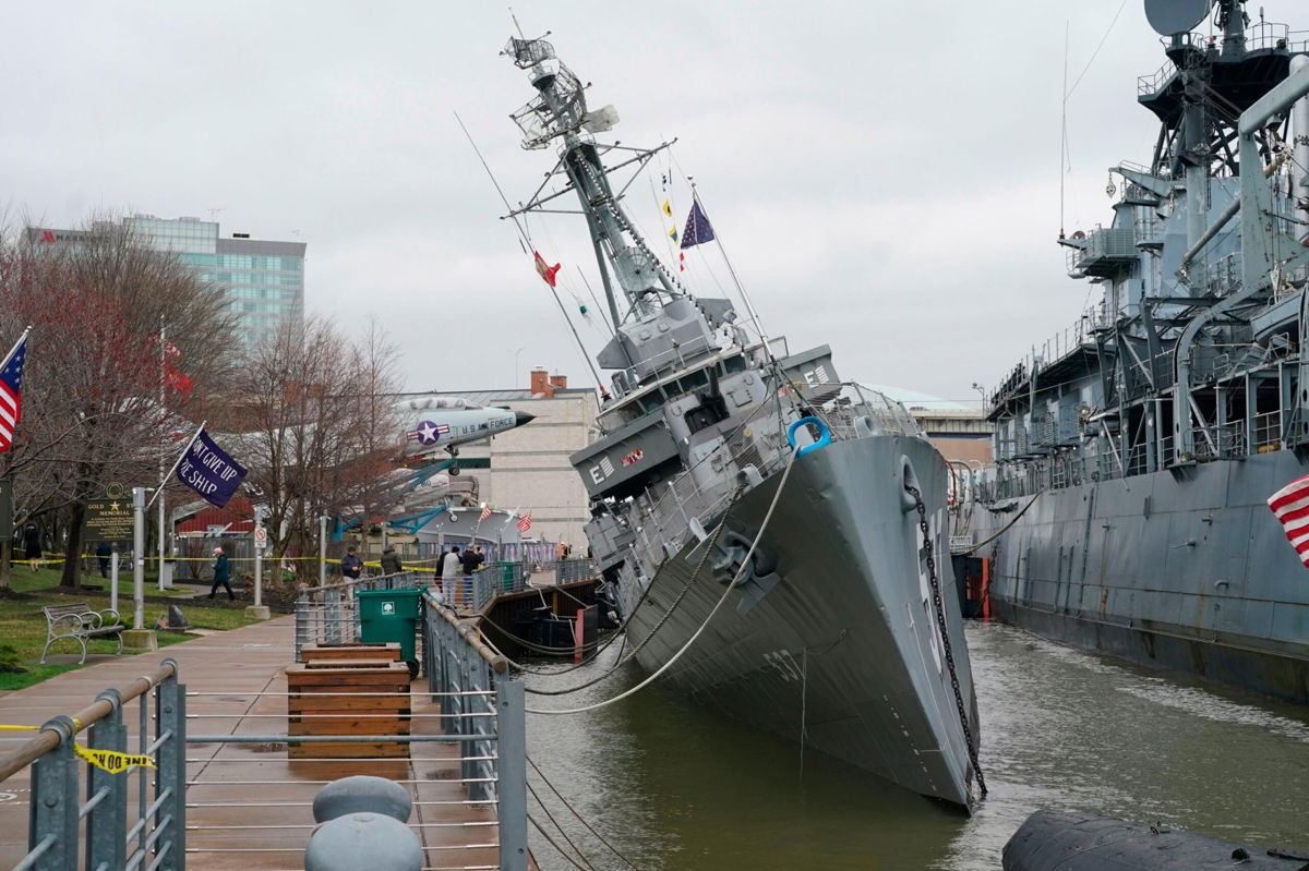 <i>Derek Gee/AP</i><br/>USS The Sullivans is tilting to one side after taking on water.