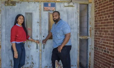 Regina and Tyson Bates in front of Torrence-Lytle School in Huntersville