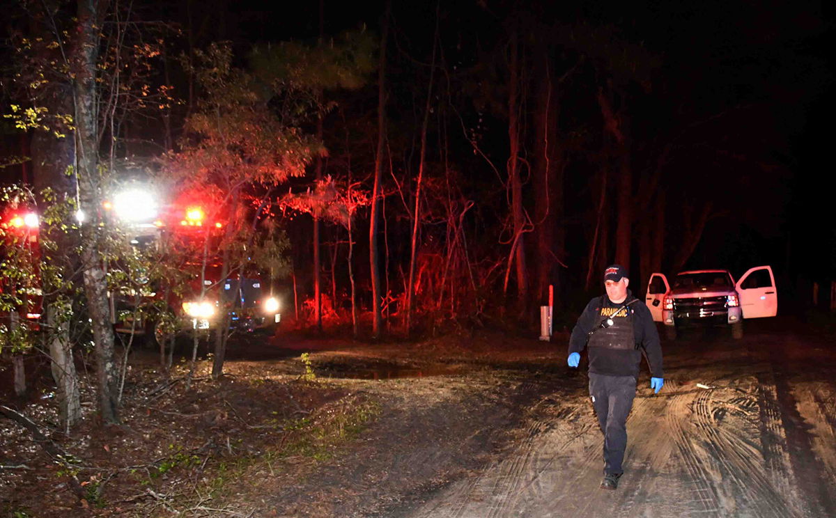 <i>Colleton County Fire Rescue</i><br/>Investigators at the scene of Friday night's shooting. Five people were injured in an April 1 shooting along a rural road in South Carolina.