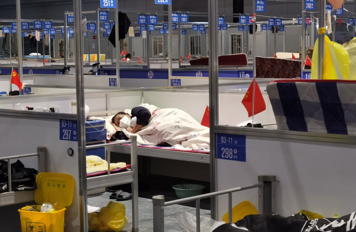 <i>Ray Young/ Feature China/Future Publishing/Getty Images</i><br/>There is an outcry as Shanghai sends vulnerable senior citizens into makeshift quarantine camps.  A man is seen sleeping in a temporary hospital for people infected with Covid in Shanghai on April 19.