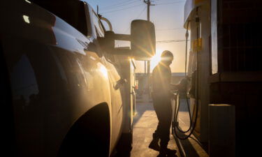 A person finishes pumping gas at a Shell gas station on April 1 in Houston