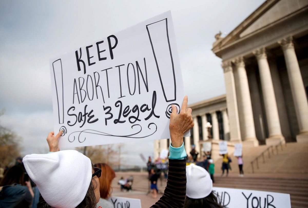 <i>Sarah Phipps/The Oklahoman/AP</i><br/>A person holds a sign during the Bans Off Oklahoma Rally on the steps on Oklahoma state Capitol in Oklahoma City