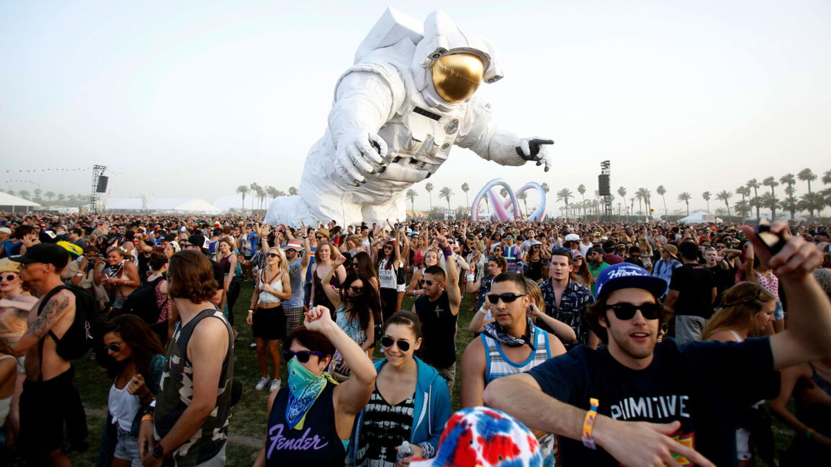 <i>Mario Anzuoni/Reuters</i><br/>Concertgoers dance around a large-scale moving sculpture called 