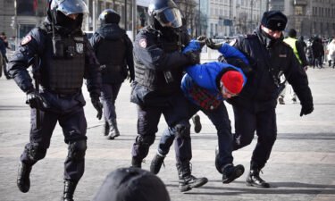 Police officers detain a man during a protest against Russia's invasion of Ukraine in Moscow on March 13.