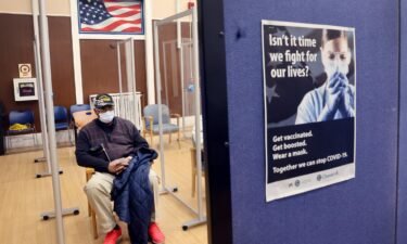 Army veteran Robert Hall waits the recommended 15 minutes to see if he will have any adverse reactions after receiving his second Covid-19 booster shot at Edward Hines Jr. VA Hospital on April 1 in Hines